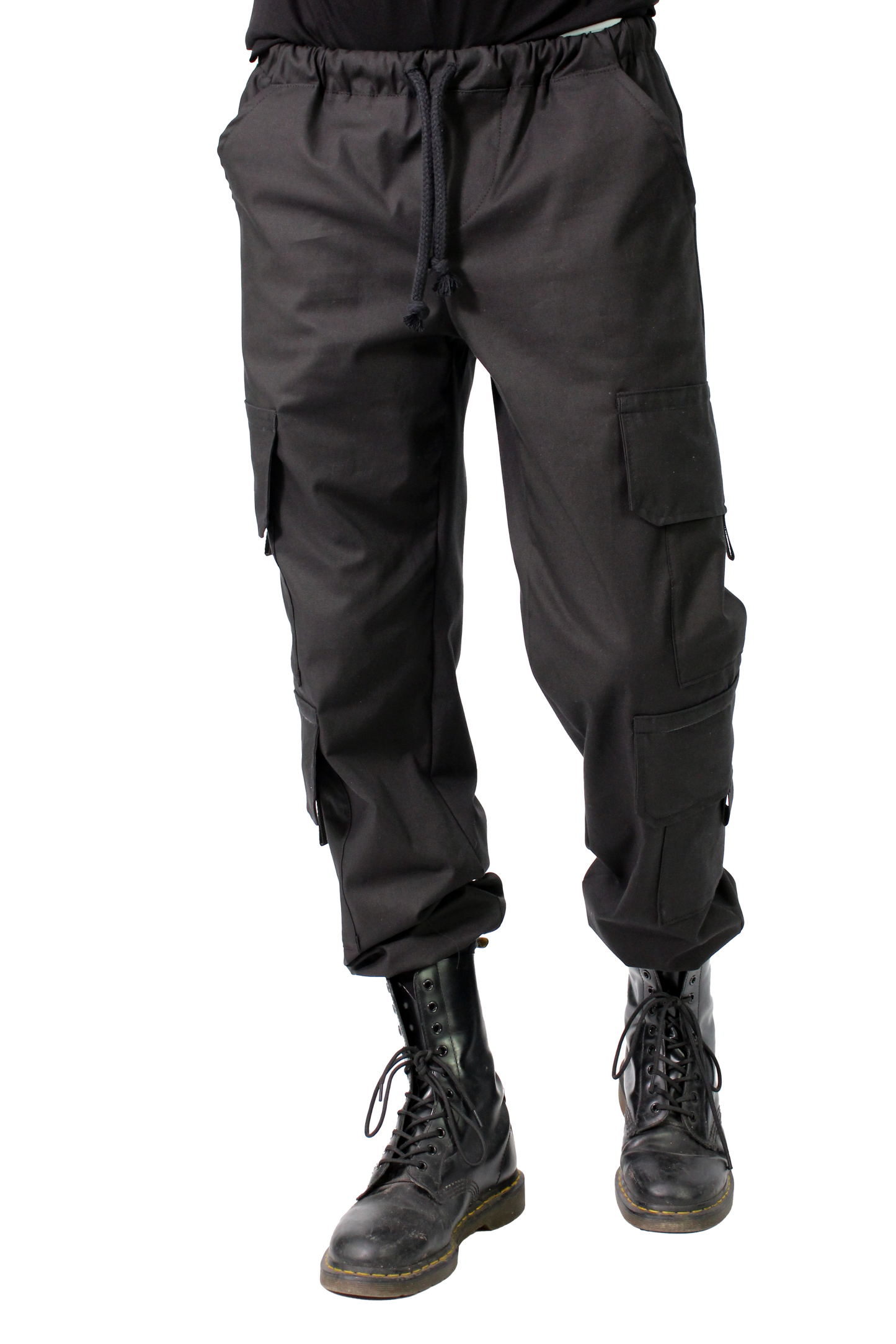 BLACK cargo pants worn with black boots on a white background