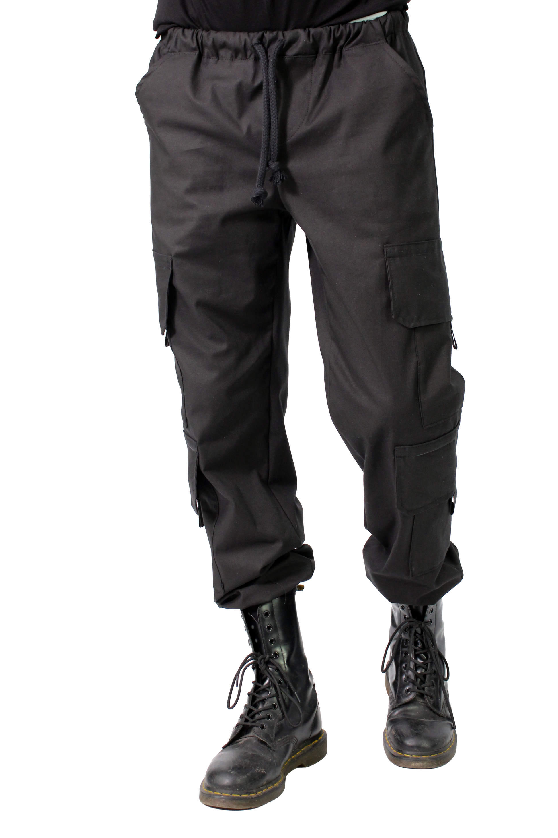 BLACK cargo pants worn with black boots on a white background